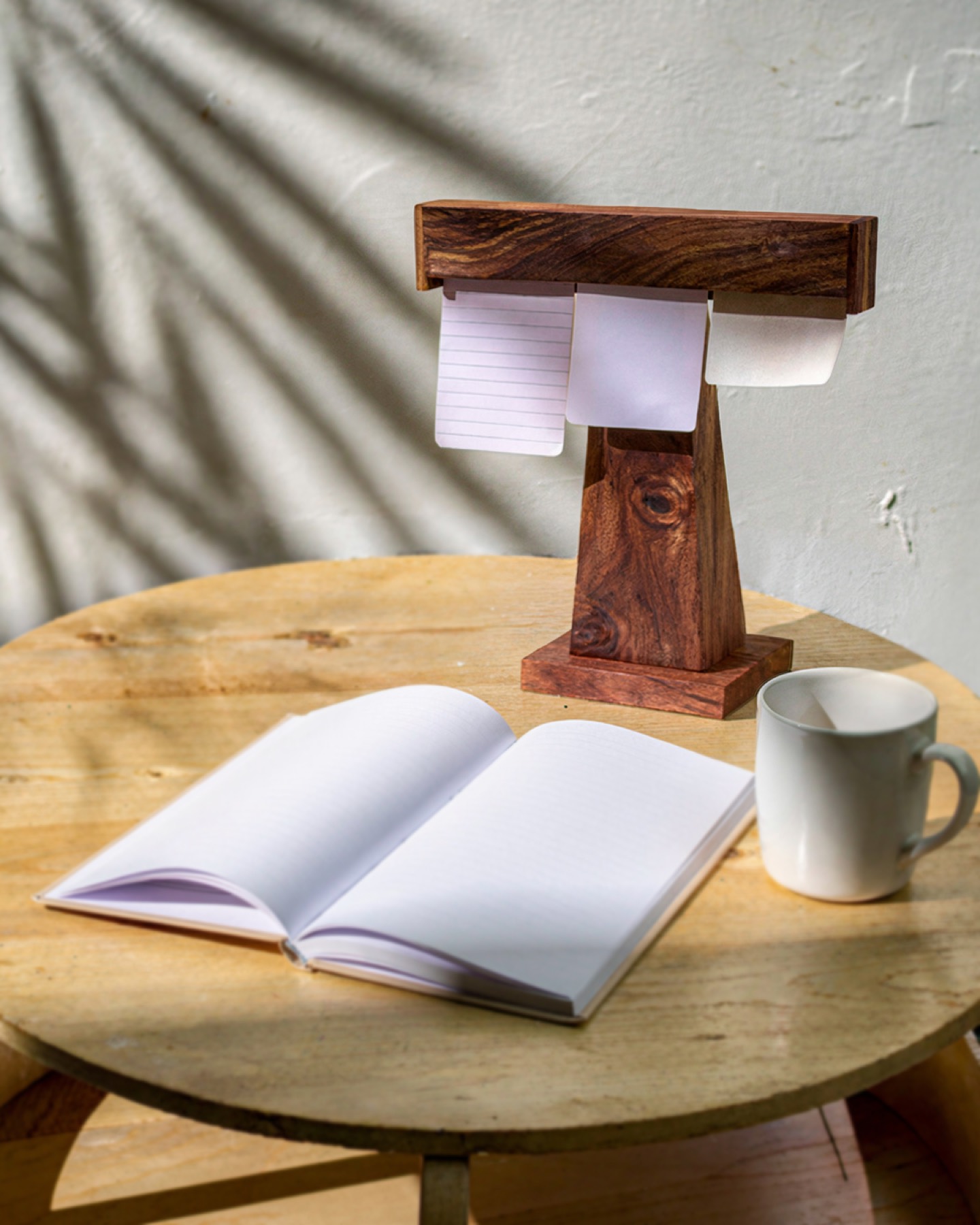 Display Dock on a round table with an open notebook